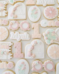 decorated cookies are displayed on a white surface