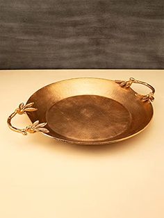 a metal tray with handles on a table