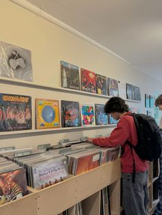 two people looking at records in a record store