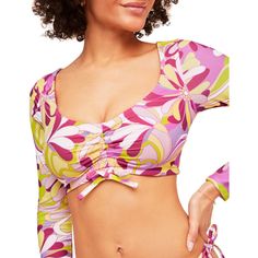 Topaz's print is so fun and unique, you'll want it on everything! This long-sleeve swim top is the perfect addition to your summer swim collection. The open-back design and functional ruching front help keep you in place and looking good. Long Sleeve Tops For Pool And Spring, Long Sleeve Swimwear For Spring Pool Season, Spring Surfing Tops With Upf 50+, Playful Long Sleeve Swimwear For Pool, Playful Long Sleeve Swimwear For Surfing, Printed Beachwear Tops For Pool, Playful Fitted Tops For Pool, Spring Upf 50+ Surfing Tops, Multicolor Long Sleeve Swimwear For Pool