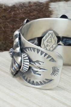 This sterling silver bracelet was made by Navajo silversmith Andrew Gordon. The inside is signed G and stamped sterling.Size: 5 3/8" (will fit up to a 6 3/8" wrist)Gap: 1 1/8"Width: 1 1/2"Free shipping on all orders! We ship with USPS and always include tracking. All orders ship within a day of payment.Returns are accepted up to 30 days after you receive your order. Just send us a message. Our shop offers cash back or store credit. The item must be returned in new condition. Southwestern Sterling Silver Bracelet, Southwestern Style Sterling Silver Bracelet, Southwestern Engraved Sterling Silver Bracelet Gift, Southwestern Style Etched Sterling Silver Bracelet, Southwestern Silver Hand-strung Bracelets, Bali Silver, Cowgirl Western, Silver Jewelry Fashion, Sterling Silver Bracelet