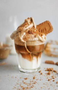 an ice cream sundae is topped with whipped cream and graham crackers on top