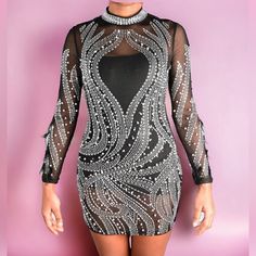 Be The Life Of The Party In This Sexy Dress! Featuring; Rhinestone And Pearls With Feathers On The Arms, Detail, Sheer Throughout The Whole Dress With Polyester Followed By A Fitted Wear. Stretch Fit. Club Sequin Dress With Rhinestones For Party Season, Sequin Dress With Rhinestones For Club And Party Season, Glamorous Sequin Dress With Rhinestones For Night Out, Elegant Sequin Dress With Rhinestones For Club, Mini Sequin Dress With Rhinestones For Party, Mini Sequin Party Dress With Rhinestones, Black Rhinestone Bodycon Dress For Club, Rhinestone Bodycon Dress For Party Season, Club Bodycon Dress With Rhinestones