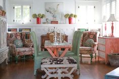 a living room filled with furniture and a fire place