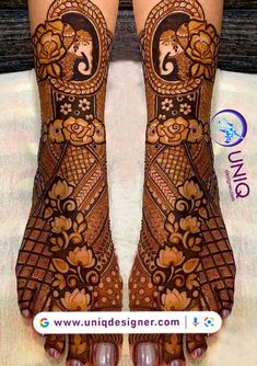 the legs and feet of a woman with henna tattoos