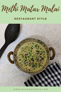 a metal bowl filled with food next to a black and white checkered table cloth