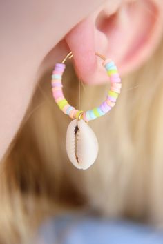 "Sunset Breeze Pastel Beaded Shell Hoop Earrings 3mm Pastel rainbow vinyl Heishi beads beaded on 20mm gold stainless steel hoops finished with cowrie shells These earrings are approximately 1.5 inches long & 1\" wide The perfect mini hoops for summer! Handmade with love by Amanda **please read my shop's policies** Thanks for viewing! 🐚" Trendy Nickel-free Hoop Earrings For Beach, Trendy Beach Hoop Earrings With Round Beads, Trendy Hoop Earrings With Round Beads For Beach, Beach Jewelry Small Hoop With Colorful Beads, Summer Rainbow Heishi Beads Jewelry, Handmade Rainbow Hoop Earrings For The Beach, Heishi Jewelry, Engagement Mehndi Designs, Pastel Beads