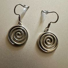 Swirl Spiraling Earring Silver Brand New For Girls Women Boy Men Men’s Women’s Unisex Silver Tone Spiral Earrings. *Brand New. *Silver Tone. *Earrings Size: 3cm/1.5 Inches Approximately. *Material: Stainless Steel And Aluminum Alloy. *Occasion: Casual, Formal, Going Out, Work, School, Gifting, Etc. *Style: Goth Grunge Aesthetic Vintage Y2k 2000s Emo Punk 90’s. Will Ship Next Day Or Same Day If Possible. Tags: #Y2k #Vintage #Earrings #Coquette #Swirl Pendant Balletcore Indie Grunge Streetwear Pre Dark Silver Earrings, 90s Jewellery, Emo Piercings, Goth Grunge Aesthetic, Indie Earrings, 90s Earrings, Grunge Earrings, 90s Jewelry, 2000s Emo