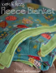 there is a blanket that has been folded up on top of each other with the words fleece blanket written below it