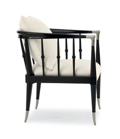 a black and white chair with two pillows on it's back end, against a white background