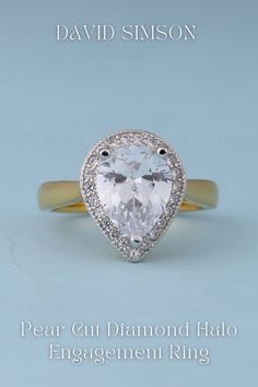 a pear cut diamond halo engagement ring