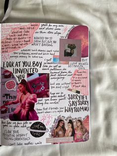 an open notebook with pictures and words on the pages, including images of women's bodies