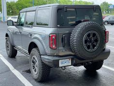 a gray truck parked in a parking lot