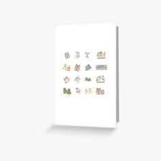 a white greeting card with christmas images on it's front and bottom corner, all in different shapes and sizes