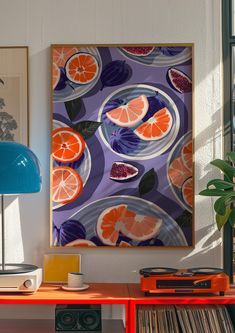 an orange slice on a plate in front of a blue lamp next to a record player