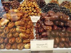 an assortment of dried fruits on display in a store