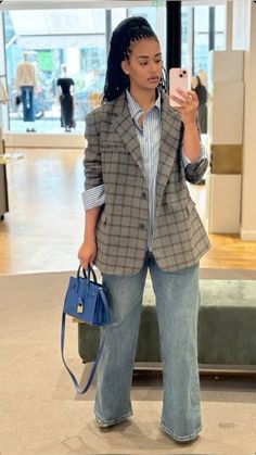 This outfit is all about blending sophistication with casual comfort. The oversized plaid blazer adds structure, while the striped shirt and wide-leg jeans create an approachable, laid-back vibe. A bold blue mini bag completes the look, adding a touch of modern elegance for a casual day out or coffee catch-up. #EffortlessStyle #PlaidVibes #CasualChic #DenimDreams #SmartCasualEssentials Colourful Everyday Outfits, Business Wear Black Women, Oversized Blazer Outfit Black Women, Cool Interview Outfit, Finding Personal Style, Blazer Tshirt Outfits For Women, Feminine Masculine Style Outfit, Lori Harvey Casual Outfits, Oversized Striped Shirt Outfit