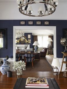 a living room filled with furniture and blue walls