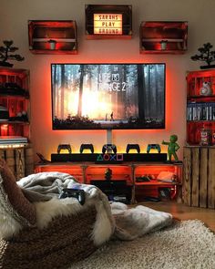 a living room filled with furniture and a flat screen tv mounted to the side of a wall