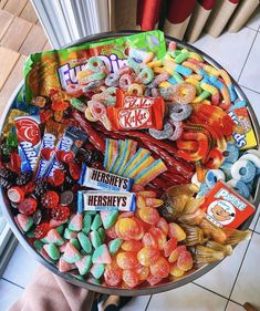 a tray filled with lots of candy on top of a table