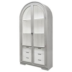 an arched glass door cabinet with white drawers