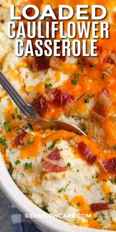 loaded cauliflower casserole with bacon and cheese in a white serving dish