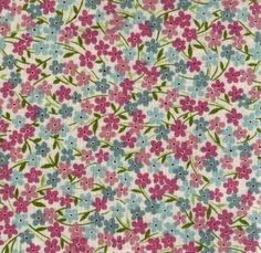 a flowery fabric with pink, blue and green flowers on it's side