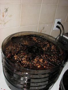 a bunch of food that is in a pan on the stove top with some water