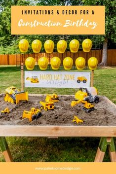 a construction birthday party with toys in the sand and on top of it is a sign that says congratulations birthday