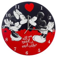 a red and black clock with two mickey mouses on it's face that says, we all need is each other