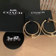 Beautiful Double Hoop Coach Earrings. New Comes Gift Wrapped In Velvet And Gold Gift Sak Great Gift Come With Pretty-Coach Insignia Card Chic Coach Jewelry As Gift, Chic Coach Jewelry As A Gift, Gold Hoop Earrings Aaa Quality, Coach Earrings, Coach Jewelry, Coach New York, Jewelry Beautiful, Gold Gift, Great Gifts