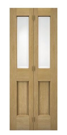 an oak double door with frosted glass panels on the side and top paneling