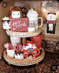 three tiered tray with coffee mugs and marshmallows