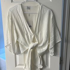 Cute Cropped Tie Up Shirt, Never Worn, Tags Attached! Elegant V-neck Beach Shirt, Chic V-neck Shirt For Vacation, Elegant V-neck Beach Top, Chic Summer Shirt For Brunch, Chic Summer Brunch Shirt, Spring V-neck Shirt For Brunch, Casual White Wrap Top, White Wrap Tops For Summer, White Wrap Top For Summer