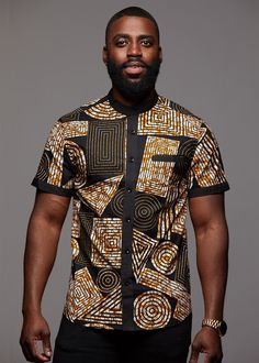 Style #M2023BBG Our unique Olu Button-Up in Black Brown Geometric is perfect for the modern man interested in looking stylish while incorporating African print. Description: 100% Cotton, African wax print with solid trimming inside collar, cuff, and top of chest pocket Designed in USA, Imported Care Instruction:Machine wash cold. Use mild detergent.Do not bleach. Hang to dry. Iron if needed Model's Information: Height: 6'0 | Size: M African Print Shirt, Nigerian Men Fashion, Men's Shirts And Tops, African Wear Styles For Men, African Attire For Men, African Dresses Men, African Shirts For Men, Afrikaanse Mode, African Clothing For Men