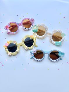 Whimsy Rays presents our "Lollipop Lovelight" collection featuring our ever adorable pearl laced sunnies. Adorn in beautiful gems & pearls with charm accents, your little girl is set to be the tiniest trendsetter in these super cute shades! Listing is for one item. Please choose your selection in the drop down menu. Shades are best fit for 2-8 years old. This item is ready-to-ship and non-customizable. All sales are final. *NOTE: potential choking hazard, products are not intended for children u Playful Party Sunglasses Personalized, Plastic Sunglasses With Tinted Lenses As Gift, Playful Personalized Sunglasses For Party, Plastic Sunglasses With Polarized Lenses As Gift, Personalized Playful Sunglasses For Party, Playful Personalized Sunglasses For Parties, Playful Tinted Sunglasses For Birthday, Plastic Polarized Sunglasses As Gift, Playful Party Sunglasses With Polarized Lenses