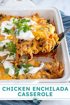 chicken enchilada casserole in a white baking dish