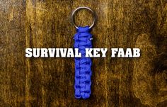 a blue keychain with the words survival key fab on it