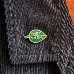 there is a pin that says they them on it