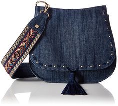 a denim purse with a tasseled strap and an embellishment on the front