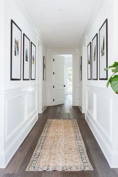 the hallway is clean and ready to be used as a place for pictures or photos