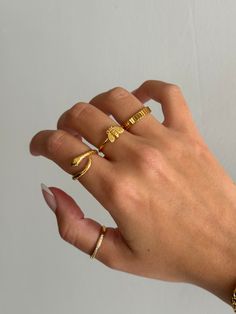 Gold coiled snake ring is adorable and edgy, and a very trendy look for jewelry. Cute serpent snake ring that non-tarnishing - stainless steel and gold - non-tarnishing Socials: Insta: @vasi.jewelry  Site: http://vasijewelry.com Tik Tok: vasi.jewelry Care - protect your jewelry from things that could scratch the surface - keep away from harsh chemicals - store jewelry away from the sun and in a microfiber pouch - clean your pieces with warm water and detergent-free soap and thoroughly dry - poli Ring Stack Mixed Metal, Gold Minimalist Snake Ring For Promise, Gold Minimalist Snake Ring As Promise Ring, Elegant Handmade Snake Ring, Adjustable Minimalist Snake Ring, Minimalist Adjustable Open Snake Ring, Gold Snake Ring As Gift, Adjustable Gold Snake Ring, Minimalist Adjustable Snake-shaped Ring