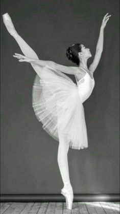 a black and white photo of a ballerina