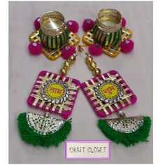 two colorful earrings with tassels on them