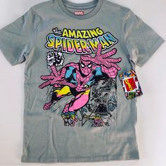 This Marvel Spider-Man Shirt Is A Children’s Size 8 And Is New With Tags. Gray In Color, It Has Vibrant, Bright, Colorful Graphics. It Is 100% Cotton Making It Lightweight And Comfortable. Great For Any Marvel Fan! Spider Man Shirt, Avengers Characters, Colorful Graphics, The Amazing Spider Man, Marvel Shirt, Man Shirt, Amazing Spider Man, Marvel Fan, Amazing Spiderman