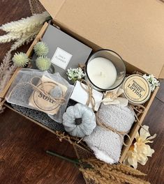 a box filled with candles, soaps and other items