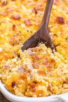 a casserole dish with cheese and bacon in it, ready to be eaten