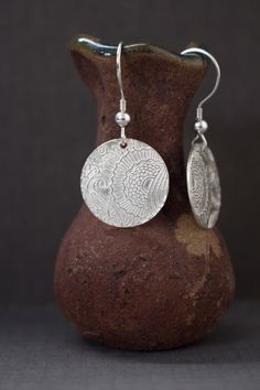 "Cute little Silver circle earrings with wonderful, sun and flowers design, made out of Precious Metal Clay. Lightweight earrings for everyday comfort. The dangles hand from a Sterling silver earwire. Dress them up or dress them down, these are fun to wear everyday! Fine silver, pure silver - .999 silver probe. The earrings are 1.25in long (30mm) with a sterling silver earwire. The circle drops are 17mm in diameter. I made these earrings using a unique material - Silver Precious Metal Clay (PMC) Pmc Earrings, Sun And Flowers, Disk Earrings, Silver Circle Earrings, Precious Metal Clay, Silver Circle, Disc Earrings, Flowers Design, Earrings Minimalist