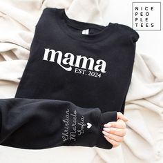 Mama Personalized Sleeve Sweatshirt, Custom Mama Crewneck, Boho Mama Sweatshirt, New Mother Sweatshirt, Mom Sweatshirt, Minimalist Mom Shirt Our graphic sweatshirts are very soft, very cute and bound to keep you warm in the colder months. It's a pre-shrunk, classic fit sweater made with air-jet spun yarn for a soft feel.  ► SHIRT DETAILS The sweatshirts are UNISEX - they are meant to have a relaxed fit, please refer to the size chart for more details. * 8.0 oz., 50/50 cotton/polyester * Pre-shrunk * Classic fit * Reduced pilling and softer air-jet spun yarn * 1x1 athletic rib knit collar, cuffs and waistband, with spandex * Double-needle stitched collar, shoulders, armholes, cuffs and waistband *If you are looking for a different fit, tank top, sweatshirt or kids shirt, please contact us a Custom Text Long Sleeve Tops For Gifts, Black Crew Neck Tops For Mother's Day, Black Long Sleeve Top As Gift, Black Long Sleeve Top As A Gift, Mother's Day Black Crew Neck Sweatshirt, Casual Long Sleeve Tops With Custom Text, Black Long Sleeve Sweatshirt With Custom Text, Custom Text Long Sleeve T-shirt For Mother's Day, Custom Text Black Top For Mother's Day