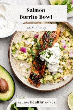 salmon burrito bowl with avocado, corn and sour cream on the side